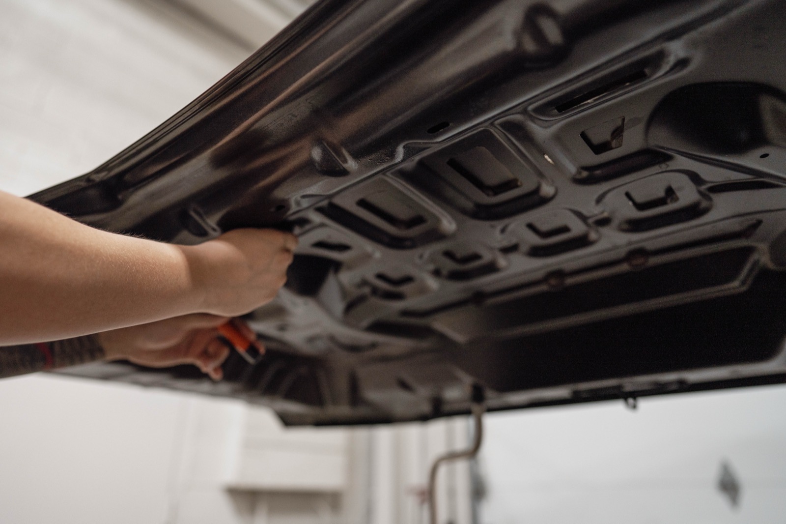 Paintless dent repair from behind the panel — the AHT method